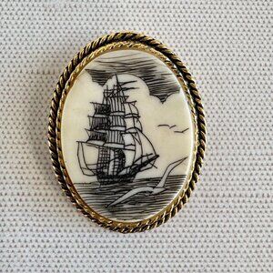 1970s Carved Bone Ship Brooch Pendant Goldtone Rope Frame 1.5 x 1.25 Inch